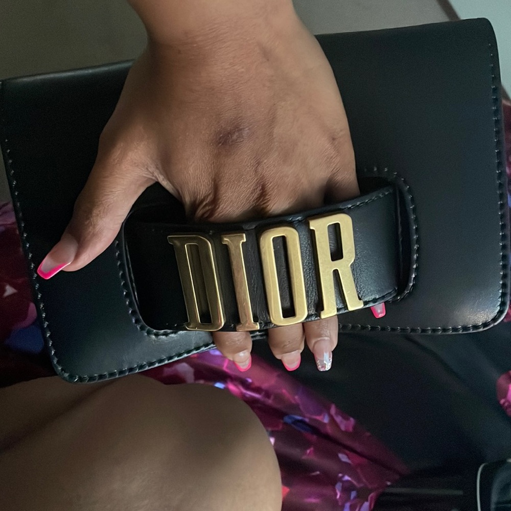 This is a Christian Dior sun visor and a purse